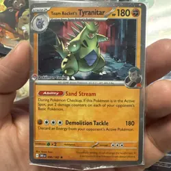Team Rocket’s Tyranitar 096/182 Promo Pokemon TCG Card Center Stamp Sealed - Image 1