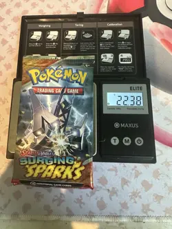 22.38g! HEAVY - Pokemon TCG Surging Sparks Booster Pack Sealed- Possible GODU - Image 1