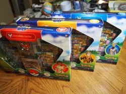 3 sealed unopened card box sets with Team Mystic, Team Instinct, and Team Valor - Image 1