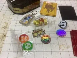 Pokemon Cards Lot, Mixed Set w/ Dice, Pins, Key Chain, pucks, & Tin. 105 cards. - Image 2