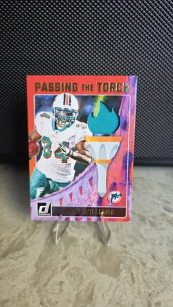 Ricky Williams / De'Von Achane 2024 Donruss #PTT-DOL Passing the Torch /199 - Image 1