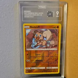 Pokemon Rockruff 2017 SM-Guardians Rising 73/145 Reverse Holo TAG Graded 9 - Image 1