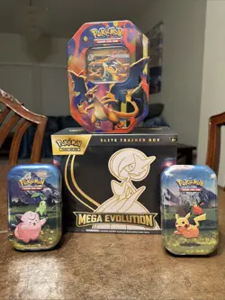Pokemon TCG ETB Mega Evolution Gardevoire - Ascended Tins and Charizard Tin - Image 1