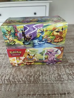 Pokemon TCG Prismatic Evolutions Mini Tin Display Case | 8 Tins / Factory Sealed - Image 1
