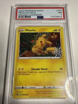 PSA 7 MINT Pikachu SWSH153 Holiday Calendar Pokemon Card - Image 1
