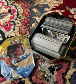 Pokemon Card Tin With Lots Of Code Cards - Image 1