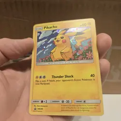 Pikachu Pokemon Black Star Promo SM206 With HD Swirl Sun and Moon Era - Image 1