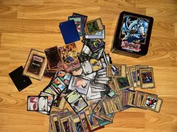 Yugioh/Dragon Ball Random Card Lot With Tin And Rulebook Some Cards With Sleeves - Image 1