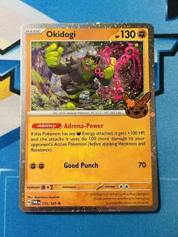 2024 Trick or Trade Okidogi #111/167 Pokemon COSMOS HOLO NM - Image 1