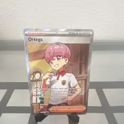Pokemon TCG Ortega Ultra Rare Full Art Trainer Holo 141/131 Prismatic Evolutions - Image 1