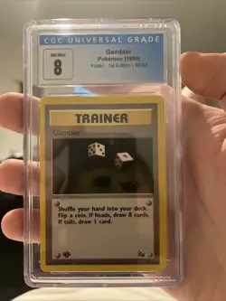 1999 Fossil 1st edition CGC 8 The Gambler Pokemon Card #60/62 - Image 1