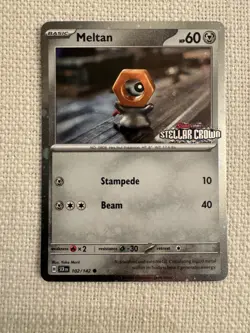 Meltan 102/142 Stellar Crown Stamped Cosmo Foil - Pokemon TCG Promo NM - Image 1
