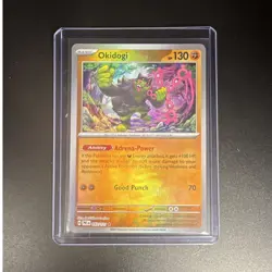 Pokemon The Pokemon Company Okidogi 057/131 Sv: Prismatic Evolutions MasterBall - Image 1