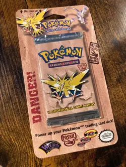 Sealed 1999 Pokemon Unlimited Fossil Booster Pack: Zapdos - Image 1