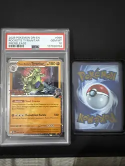 2025 POKEMON DESTINED RIVALS PRERELEASE-STAFF TEAM ROCKET'S TYRANITAR PSA 10 - Image 1