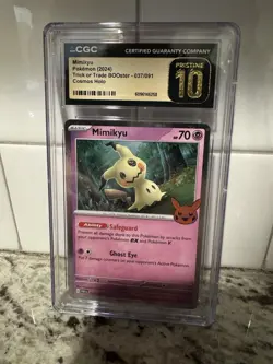 2024 POKEMON TRICK OR TRADE BOOSTER COSMOS HOLO #037/091 MIMIKYU CGC Pristine 10 - Image 1
