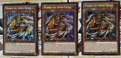 YuGiOh PLAYSET Mudora the Sword Oracle SBC2-ENF01 Secret Rare 3x - Image 1