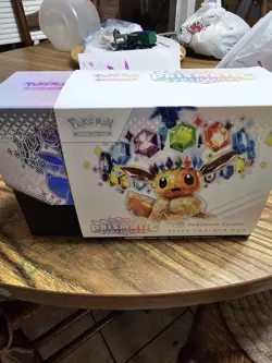 Prismatic Evolutions Pokemon Center Exclusive Elite Trainer Box OPENED IN HAND - Image 2