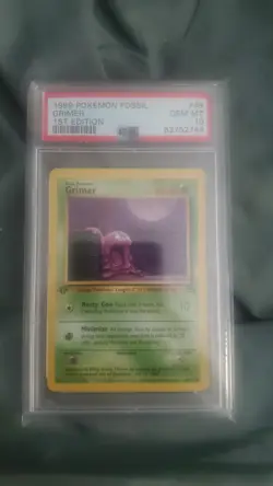 1999 Pokemon Fossil Grimer 1st Edition PSA 10 - Image 1