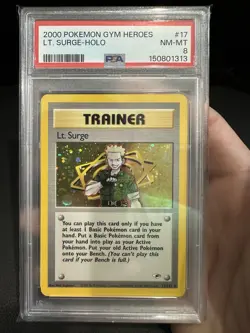 Pokemon Lt. Surge Trainer Gym Heroes TCG 017/132 With Swirl PSA 8 - Image 1