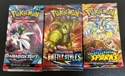 POKEMON TCG SURGING SPARKS, BATTLE STYLES, AND PARADOX RIFT PACK LOT (3 PACKS) - Image 1