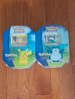 Lot Of 4 - Pokemon Go 2 Pikachu & 2 Snorlax Tin Trading Card Game Factory Sealed - Image 1