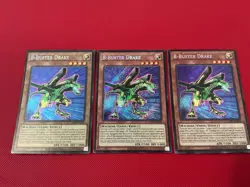 3x B-Buster Drake - Secret Rare - LCKC-EN020 - Unlimited Ed NM Foil Bleed - Image 1