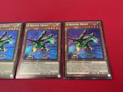 3x B-Buster Drake - Secret Rare - LCKC-EN020 - Unlimited Ed NM Foil Bleed - Image 2