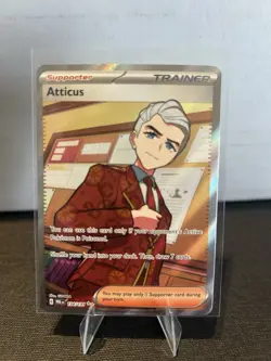 Atticus #134/131 (Prismatic Evolutions) SV: PRE Pokemon *Trainer* NM - Image 1