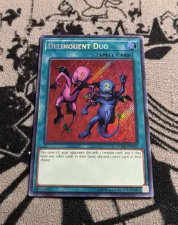 YU-Gi-Oh! LCKC-EN101 Delinquent Duo Secret Rare UNLIMITED EDITION NM - Image 1