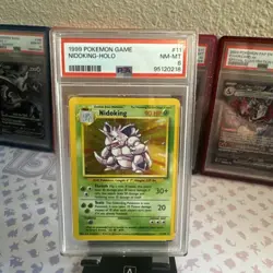 1999 POKEMON BASE SET UNLIMITED #11 NIDOKING-HOLO PSA 8 - Image 1