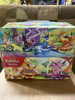 NEW POKEMON TCG PRISMATIC EVOLUTIONS MINI TIN DISPLAY BOX WITH 8 SEALED TINS - Image 1