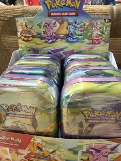 NEW POKEMON TCG PRISMATIC EVOLUTIONS MINI TIN DISPLAY BOX WITH 8 SEALED TINS - Image 2