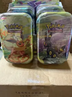 NEW POKEMON TCG PRISMATIC EVOLUTIONS MINI TIN DISPLAY BOX WITH 8 SEALED TINS - Image 3