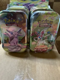 NEW POKEMON TCG PRISMATIC EVOLUTIONS MINI TIN DISPLAY BOX WITH 8 SEALED TINS - Image 4