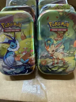 NEW POKEMON TCG PRISMATIC EVOLUTIONS MINI TIN DISPLAY BOX WITH 8 SEALED TINS - Image 5