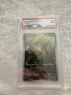 2024 POKEMON SSP EN-SURGING SPARKS ILLUSTRATION RARE #198 FEEBAS PSA 9 - Image 1