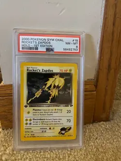 Pokemon 1st Edition Rocket's Zapdos Holo PSA 8 - Image 1