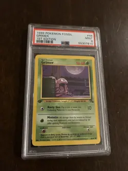 1999 Pokemon Fossil 1st Edition #48 - Grimer PSA 9 - Image 1
