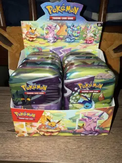Pokemon TCG Prismatic Evolutions Full Set of 8 Sealed Mini Tins With Display - Image 1