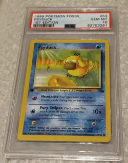 1999 POKEMON FOSSIL #53 PSYDUCK 1ST EDITION PSA 10 - Image 1