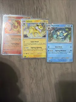 Pokemon TCG: Prismatic Evolutions Poster Collection Cosmos Holo Promos Set of 3 - Image 1