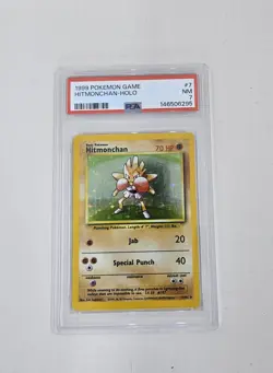 1999 POKEMON BASE SET UNLIMITED #7 HITMONCHAN-HOLO PSA 7 - Image 1