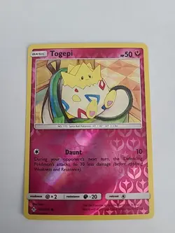 Pokemon 2019 Unbroken Bonds Togepi 136/214 Reverse Holofoil NM - Image 1