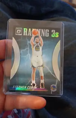 2023-24 Panini Donruss Optic - Raining 3s Stephen Curry #9 Holo Prizm - Image 1