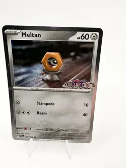 Meltan 102/142 Stellar Crown Cosmos Holo Pokemon 2024 Promo NM - Image 1
