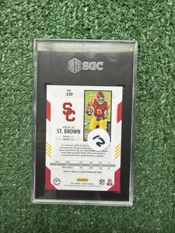 2021 Panini Score Amon-Ra St. Brown RC Gold Zone Rookie #/50 Trojans SGC 9.5 - Image 2