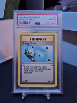 1999 POKEMON FOSSIL 1ST ED #59 ENERGY SEARCH PSA 8 - Image 1
