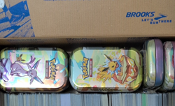 Pokemon TCG prismatic tins x8 (empty with coins) and bulk card lot. 2 shoe boxes - Image 1