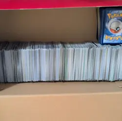 Pokemon TCG prismatic tins x8 (empty with coins) and bulk card lot. 2 shoe boxes - Image 2